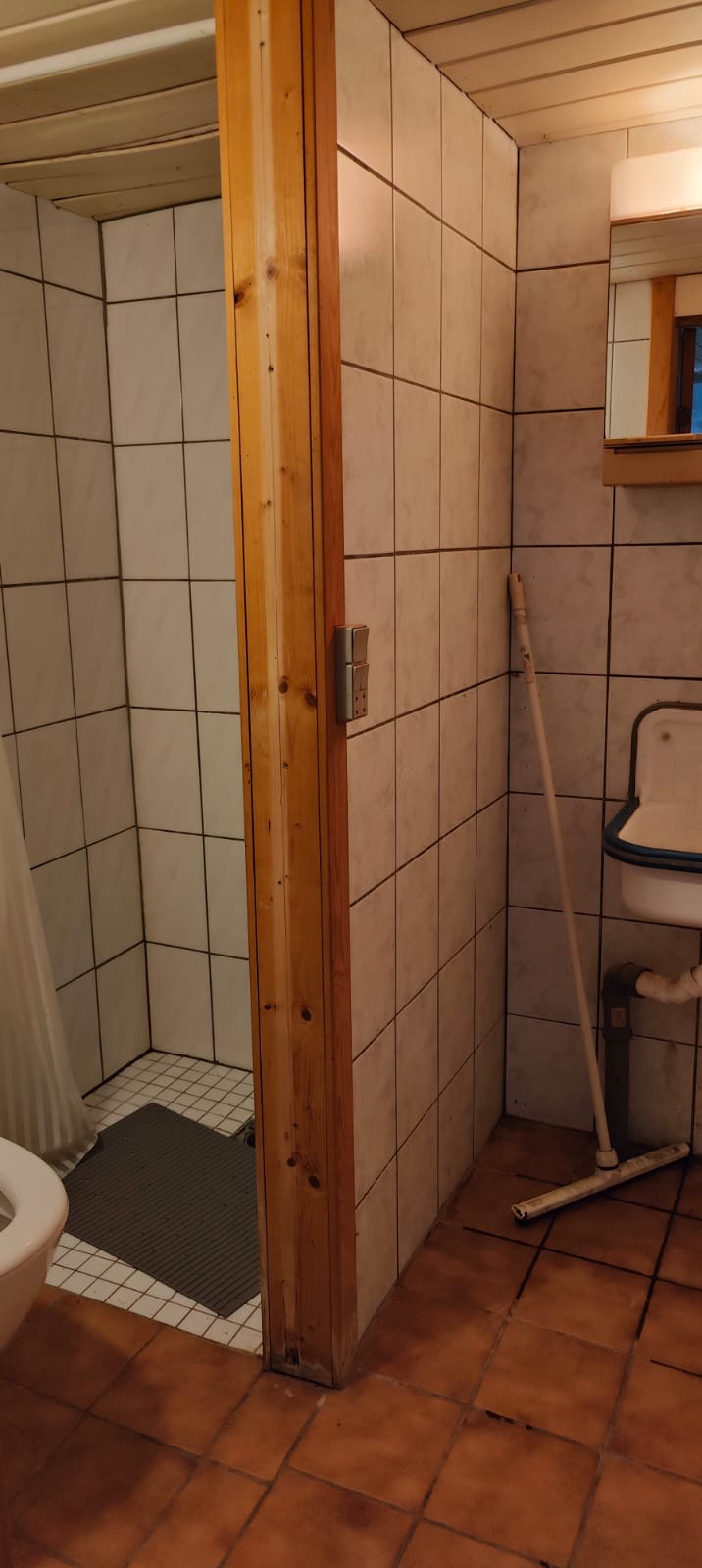 Camper bathroom with walk-in shower, tiled walls and utility sink at Holeby Rejsestald